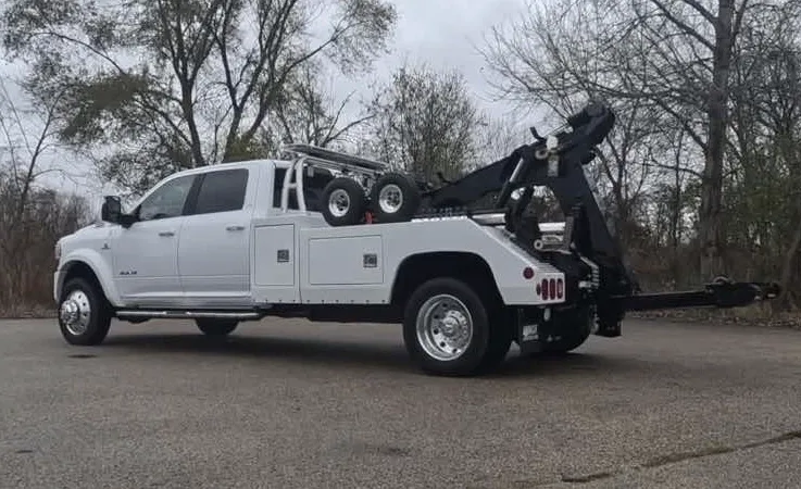 Baltimore wrecker equipment securing damaged vehicle